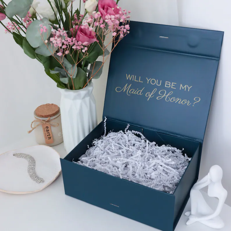 empty bridesmaid gift box with shredded paper filler