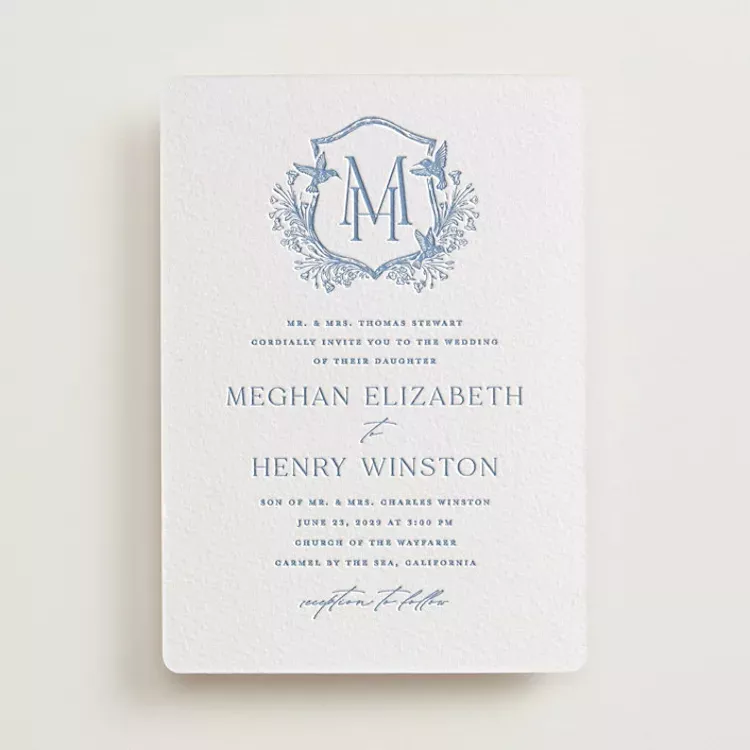 wedding invitation detail shot featuring letterpress texture and soft shadows