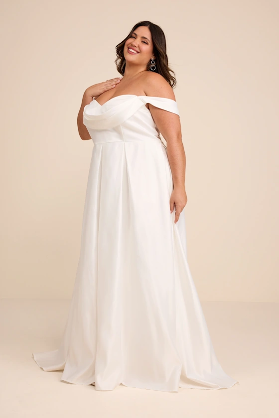 off-the-shoulder taffeta wedding dress that drapes away from midsection