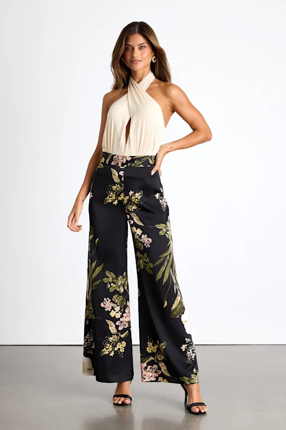 wedding guest wearing dressy top and wide leg floral pants instead of dress