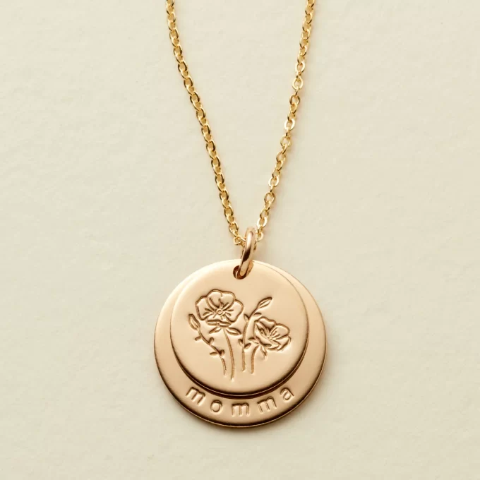 disc style round necklace with mama imprinted on it