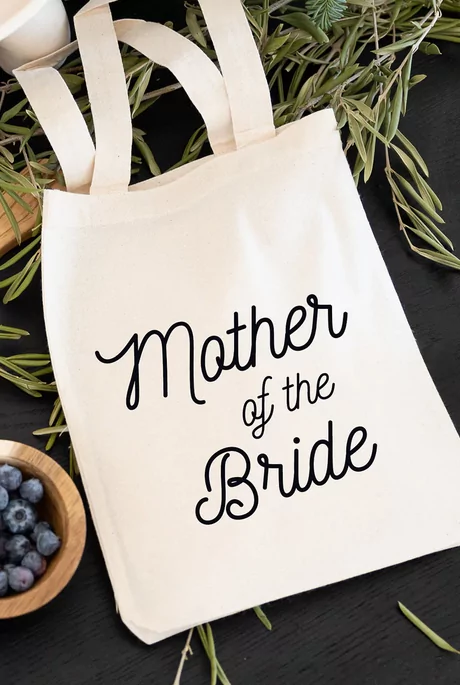 large tote bag gift for the mother of the bride with script writing on the exterior of the bag