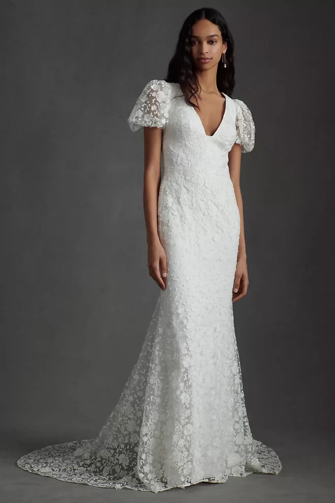 floral lace wedding dress that has v-neckline and puff sleeve detail