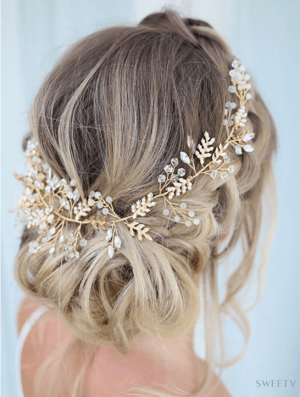 bride wearing a floral hair vine