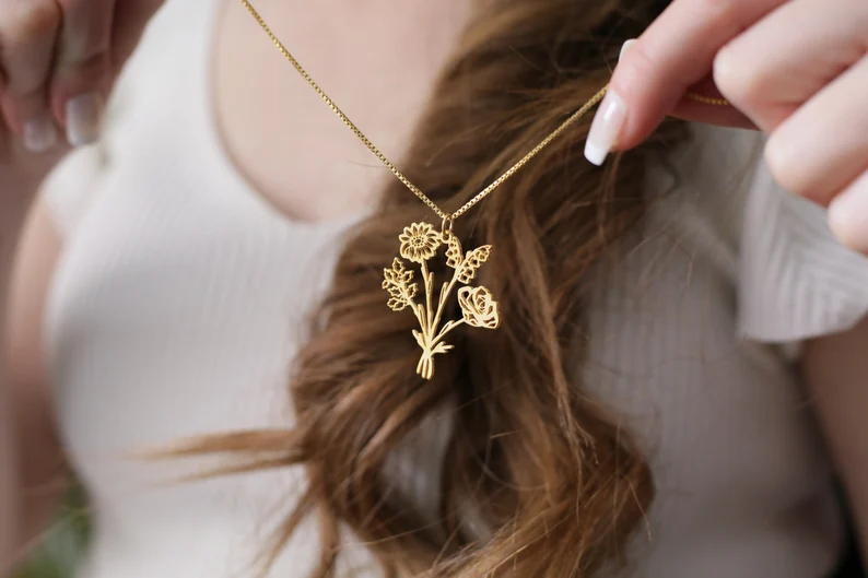 combined bouquet of birth flowers on a necklace
