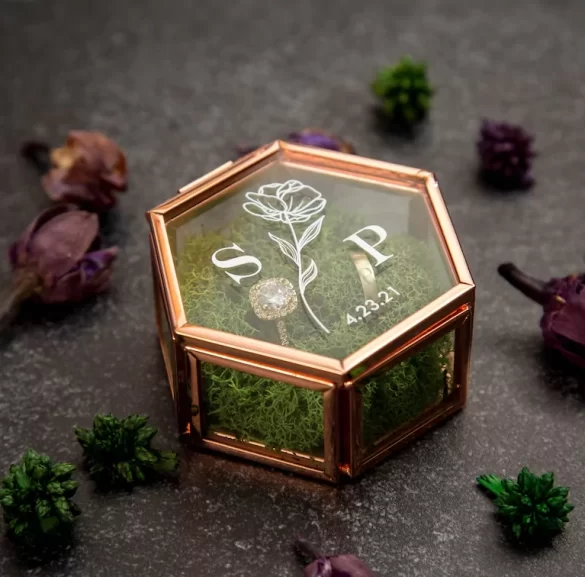 hexagon glass wedding ring box with moss inside