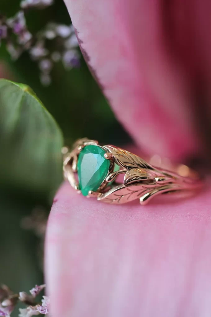 natural emerald engagement ring with leaf band