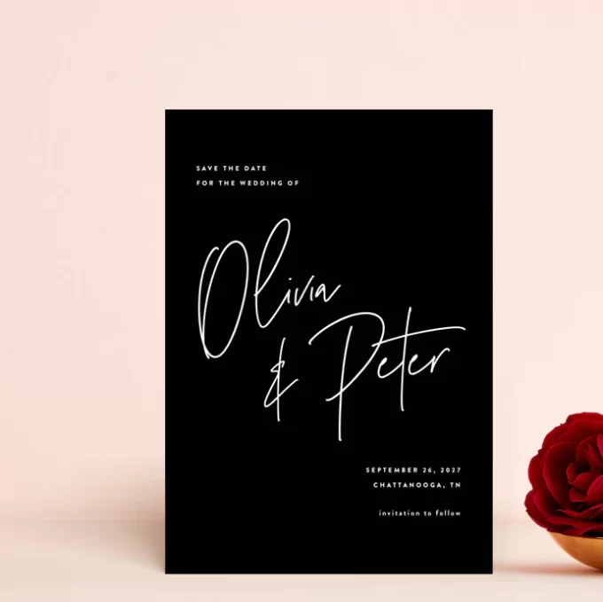 black save the dates with white lettering