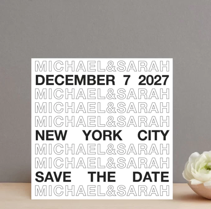 bold block lettering black and white save the date