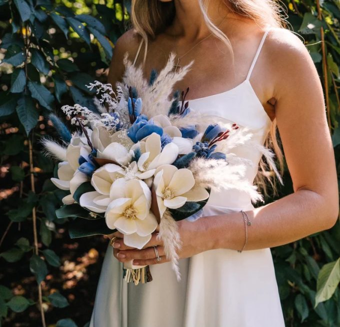 blue bridal bouquet with magnolias