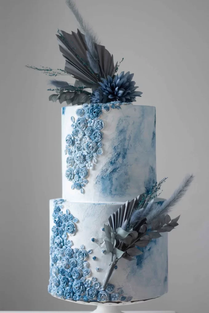 dusty blue cake with blue topper