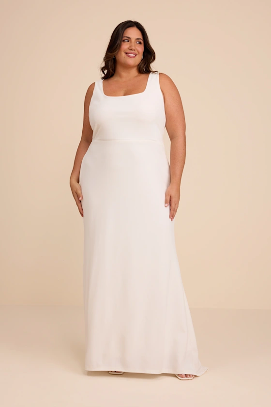 bride wearing plus size bridal shower dress in white maxi length