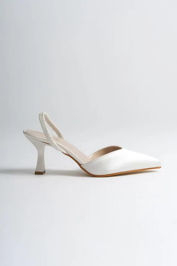 Close-up of cushioned satin slingback wedding shoes