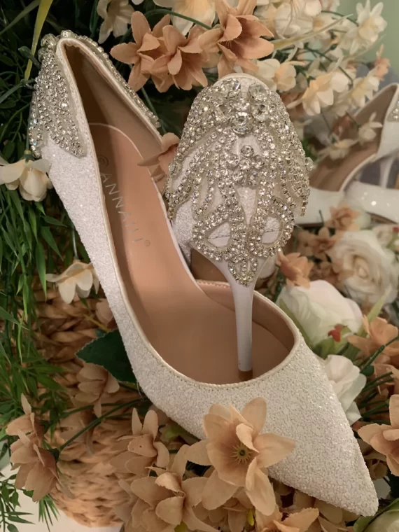 Satin bridal pumps with delicate rhinestone detailing on the back