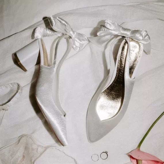 White satin low heel bow backed shoes