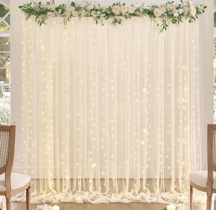 Elegant Pearls and Prosecco bridal shower lighted tulle backdrop with soft fairy lights