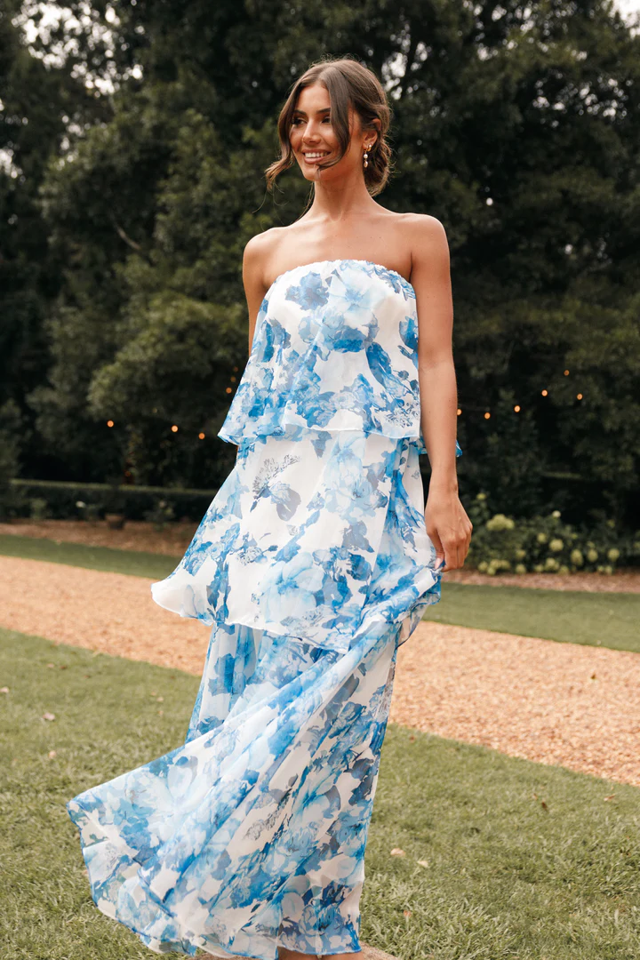 Blue White Floral Maxi Dress with strapless design, elasticized neckline, and drop-tiered ruffle design. Perfect for formal and special events. Rated 4.2 stars from 189 reviews.