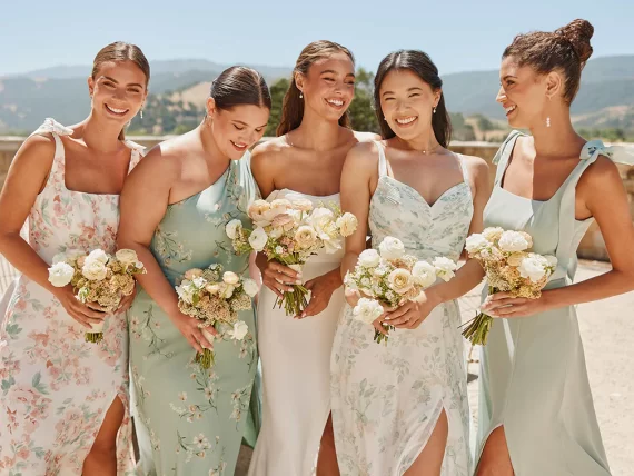 bridesmaids wearing floral patterned dresses that aren't typical bridesmaid dresses