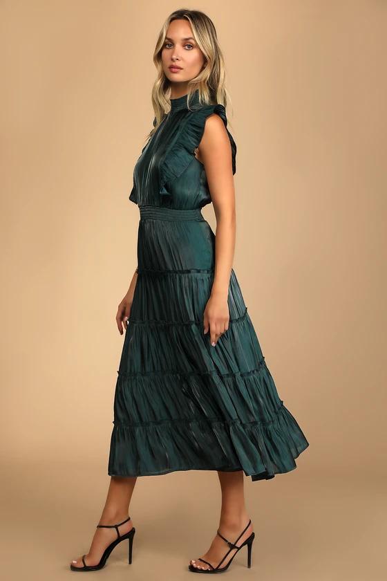 emerald green mock neck wedding guest dress with sleeveless style and ruffles