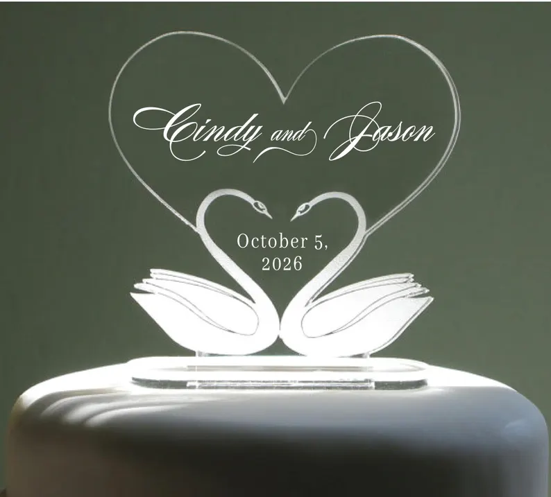 acrylic wedding cake topper with swans and name with wedding date