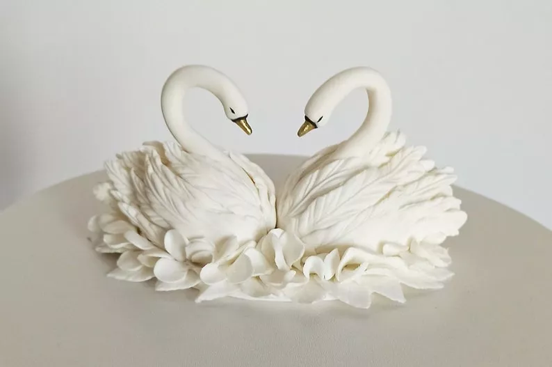 wedding cake topper with swans