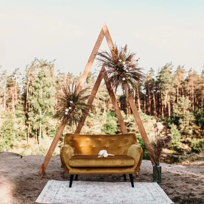 triangular shaped wedding arch for a boho ceremony