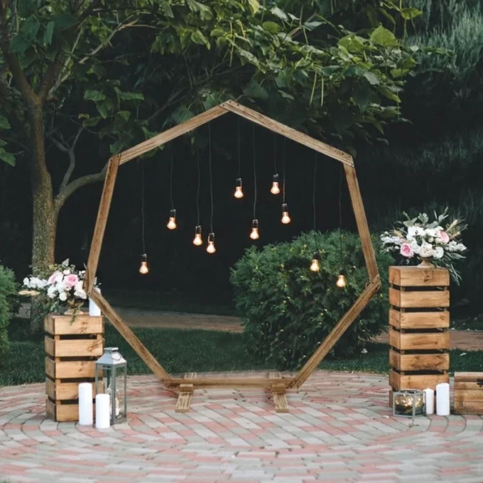 heptagonal wedding arch with lights on top