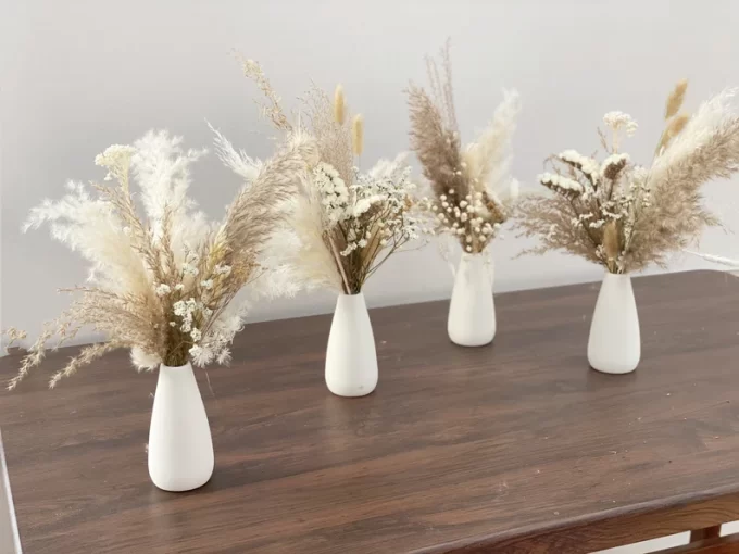 Bud vases with dried pampas flowers