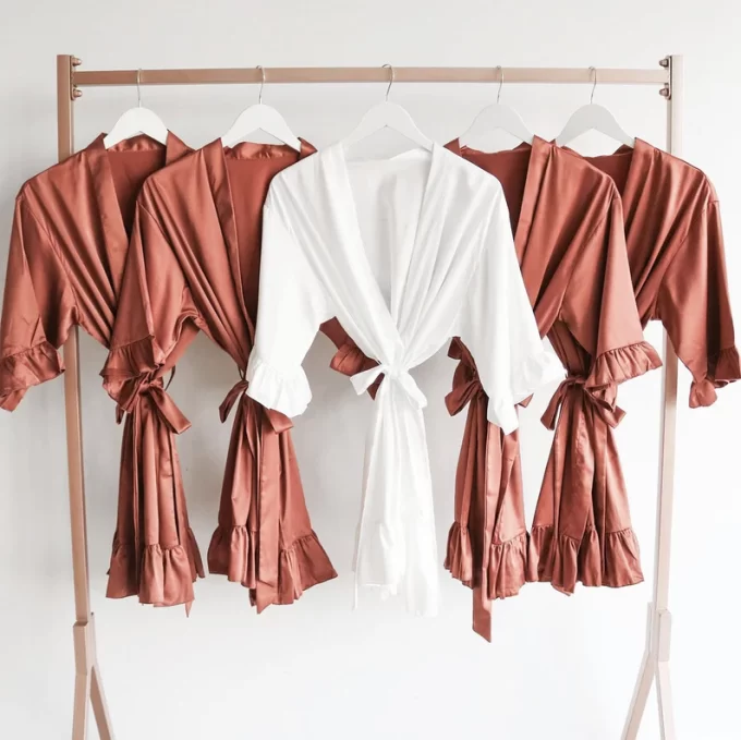 Bridesmaid wedding day robes in rust