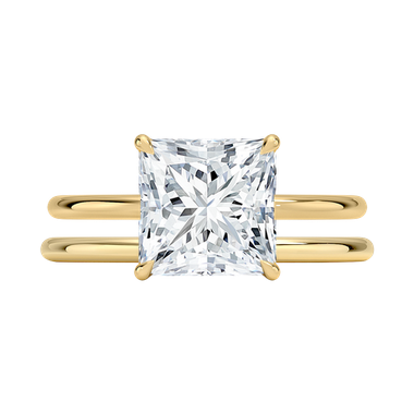 Princess cut diamond engagement ring paired with simple wedding band