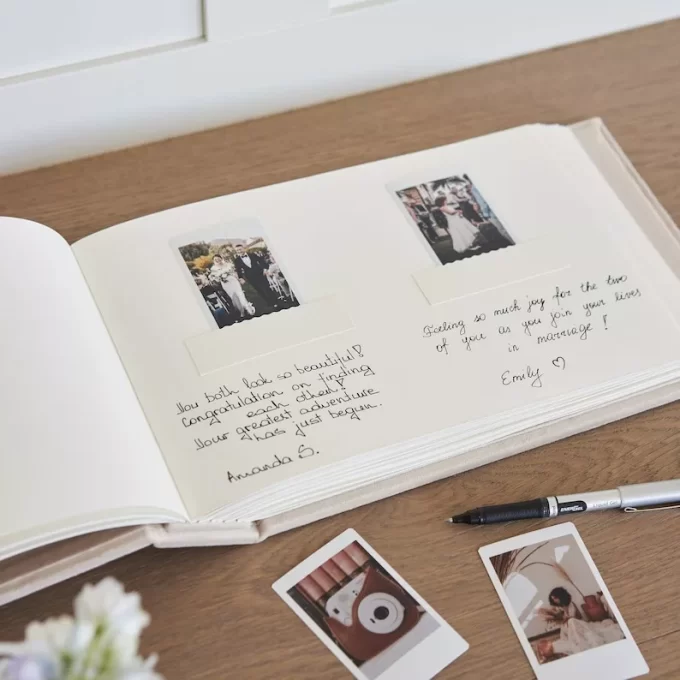 Wedding guest book inside with photos on pages