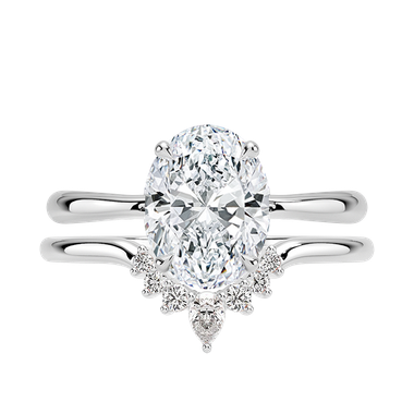 Oval solitaire diamond ring paired with curved diamond band