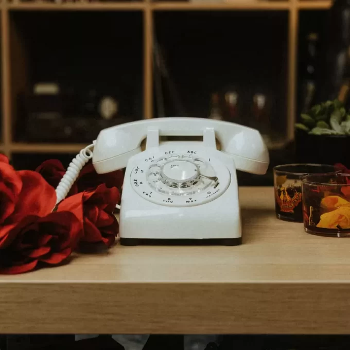 Beautiful wedding table display with AfterTheTone audio guest book phone and floral decor