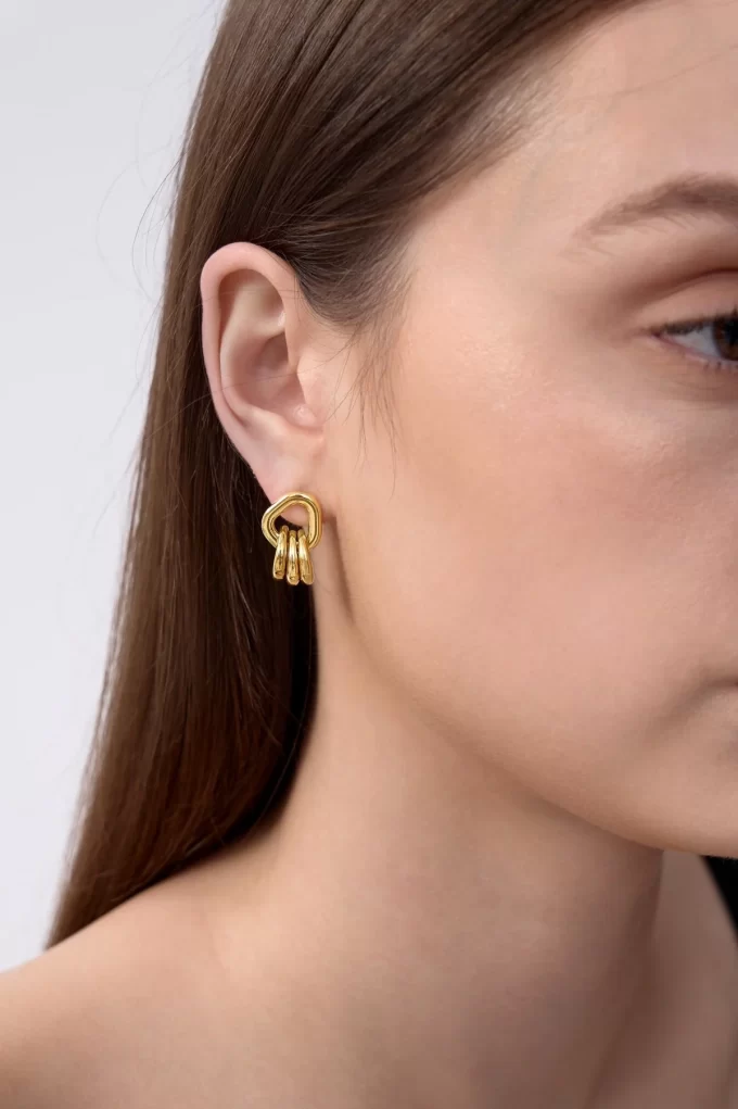 Gold stacked loop style earrings by Flaire & Co.