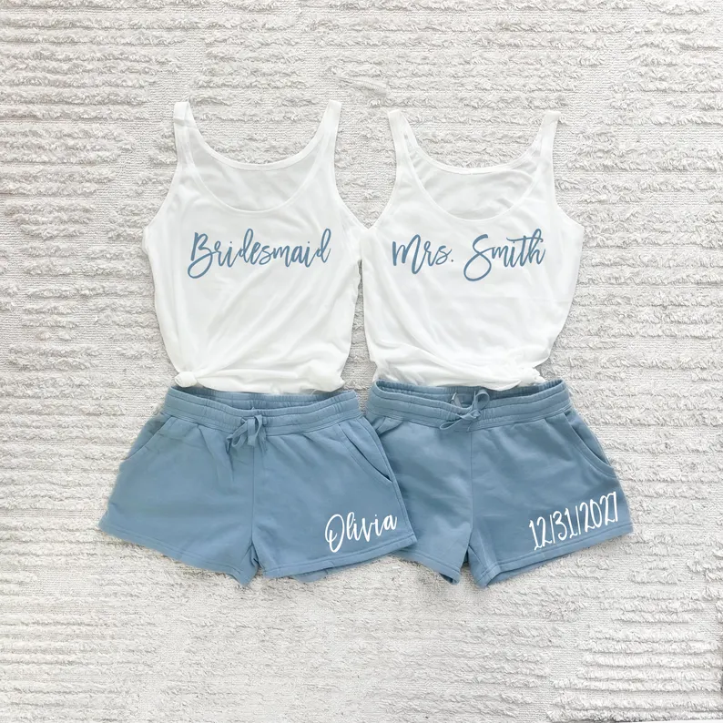 bridesmaids wearing tank tops and shorts while getting ready