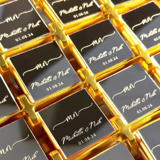 Personalized chocolate wedding favors with plexiglass foil wrapping