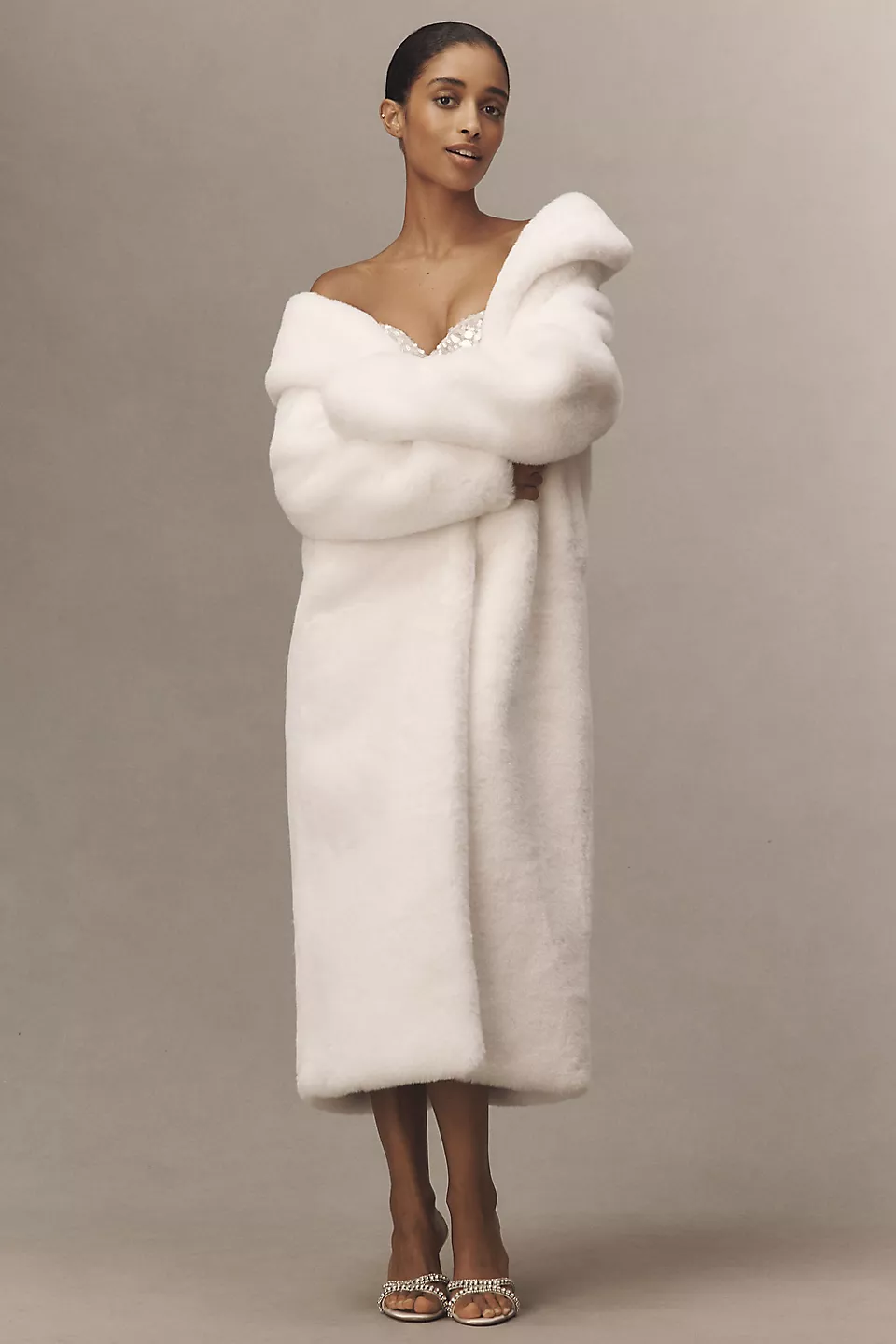Long white faux-fur coat for a winter bride