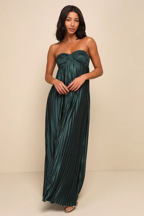 Woman wearing emerald pleated strapless dress