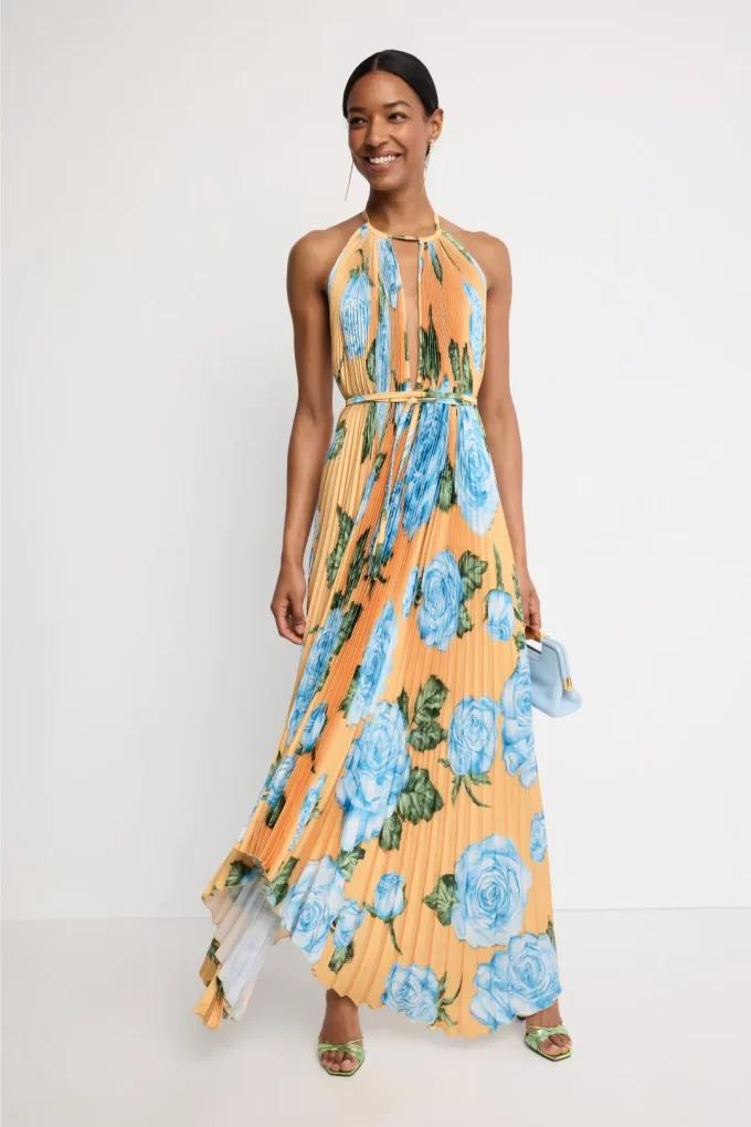 Woman in a beach wedding guest dress with orange and blue