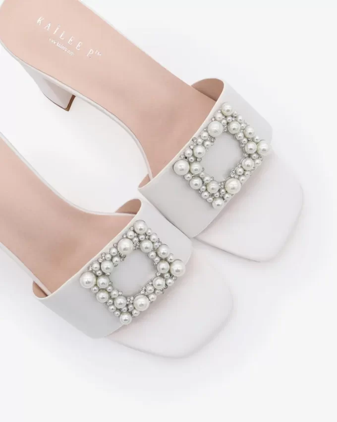 White block slides with pearls