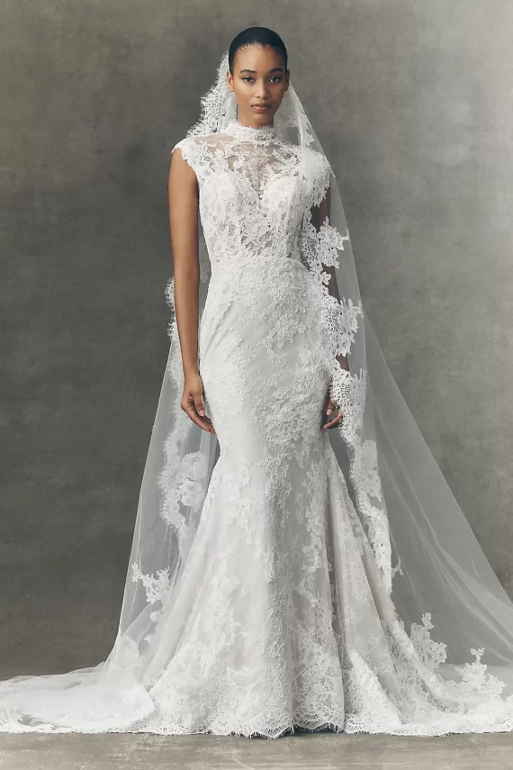Lace wedding dress with cap sleeves worn by bride