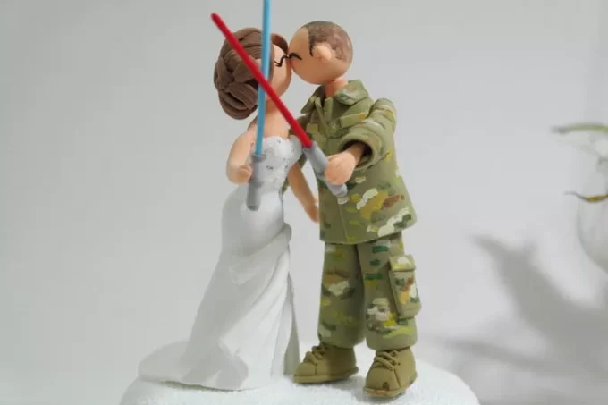 Army wedding cake topper with bride and groom in uniform