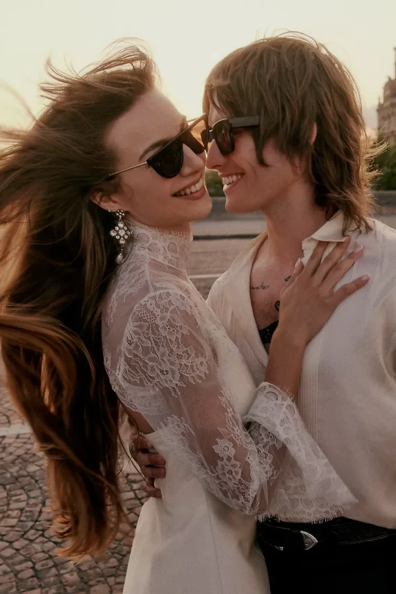 Bride with hair back wearing statement earrings on wedding day