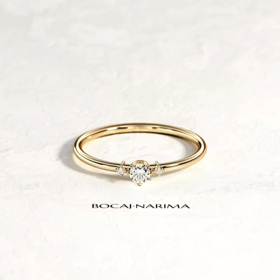dainty three stone engagement ring