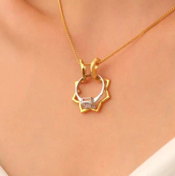 Flower-shaped ring holder necklace holding an engagement ring