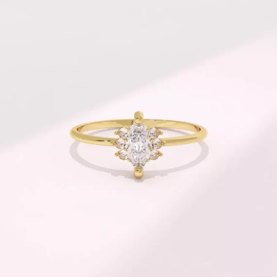 Dainty gold marquise engagement ring
