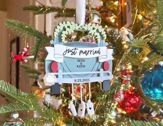 christmas ornament for newlyweds featuring a car that say just married