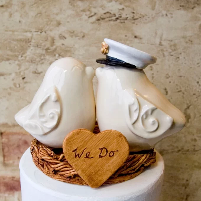 Marine officer hat on bird pair cake topper