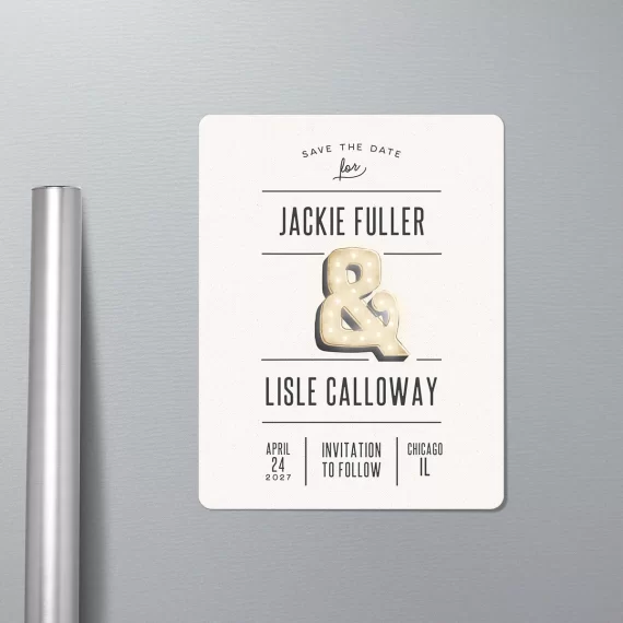 Magnet save the dates with names and marquee ampersand as the design