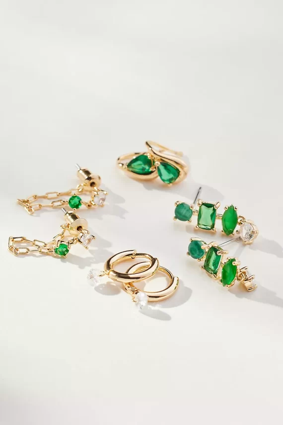 Close-up of emerald birthstone earrings for May
